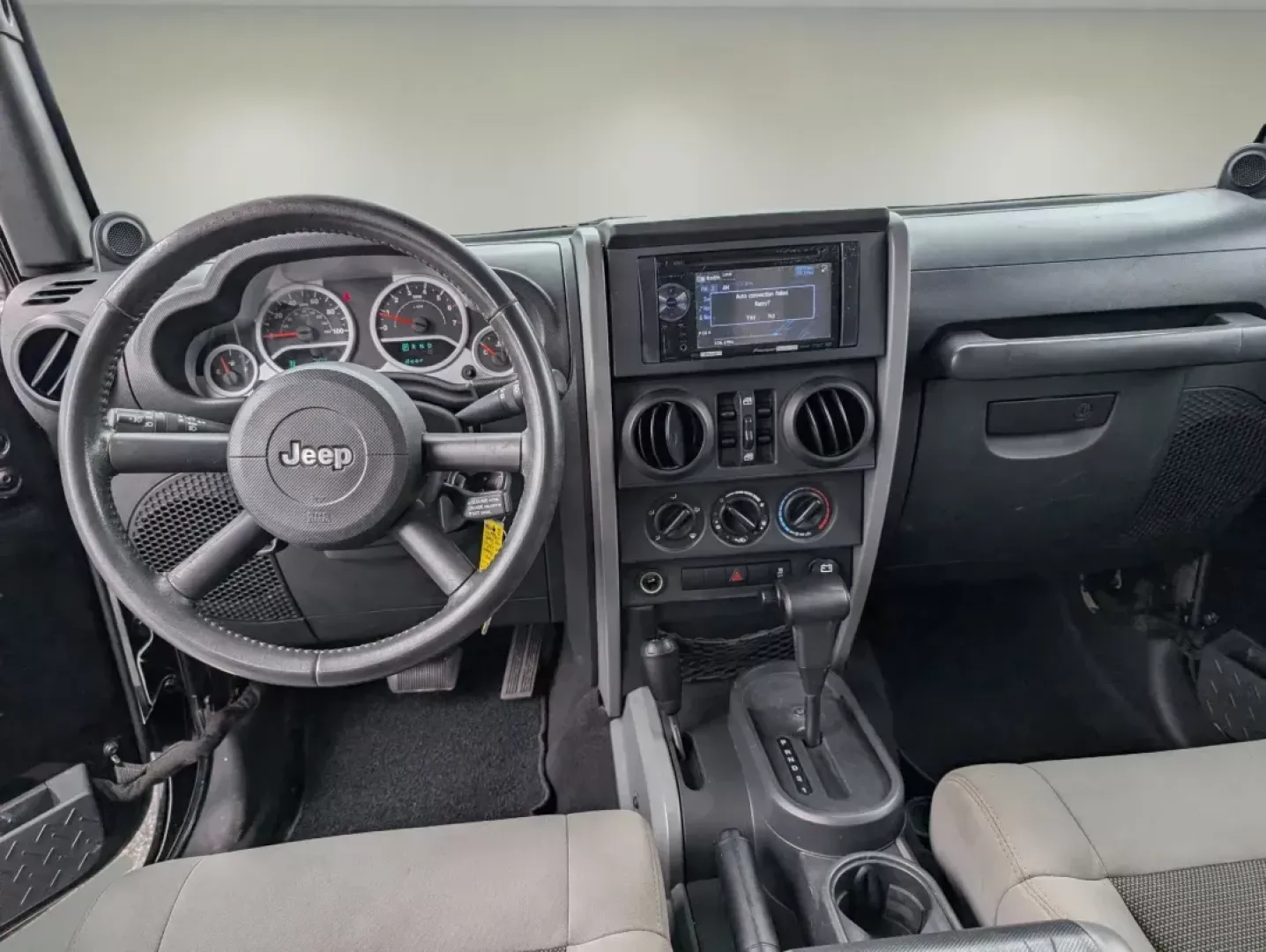 2010 /Dark Slate Gray/Medium Slate Gray Jeep Wrangler Unlimited Sport (1J4BA3H18AL) with an Gas V6 3.8L/231 engine, 4-Speed Automatic transmission, located at 3959 U.S. 80 W, Phenix City, AL, 36870, (334) 297-4885, 32.469296, -85.135185 - 2010 Jeep Wrangler Unlimited Sport - Photo#11