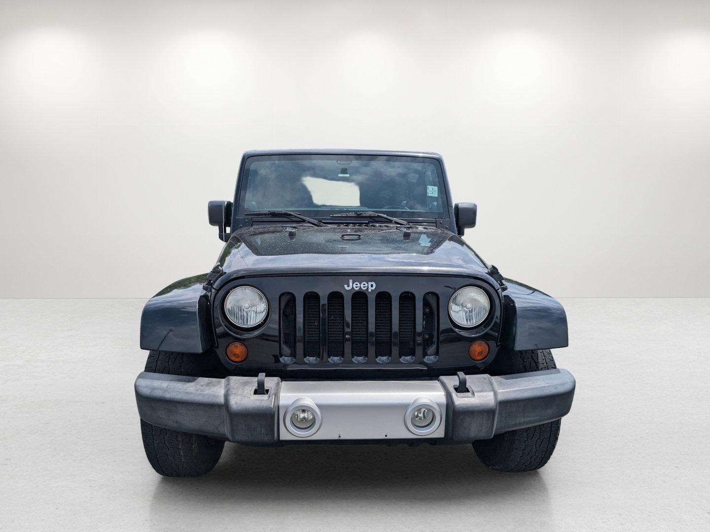2012 Black /Black Interior Jeep Wrangler Unlimited Sahara (1C4BJWEG4CL) with an Gas V6 3.6L/220 engine, 5-Speed Automatic transmission, located at 804 22nd Ave, Phenix City, AL, 36870, (334) 297-1860, 32.484749, -85.024475 - 2012 Jeep Wrangler Unlimited Sahara - Photo#1