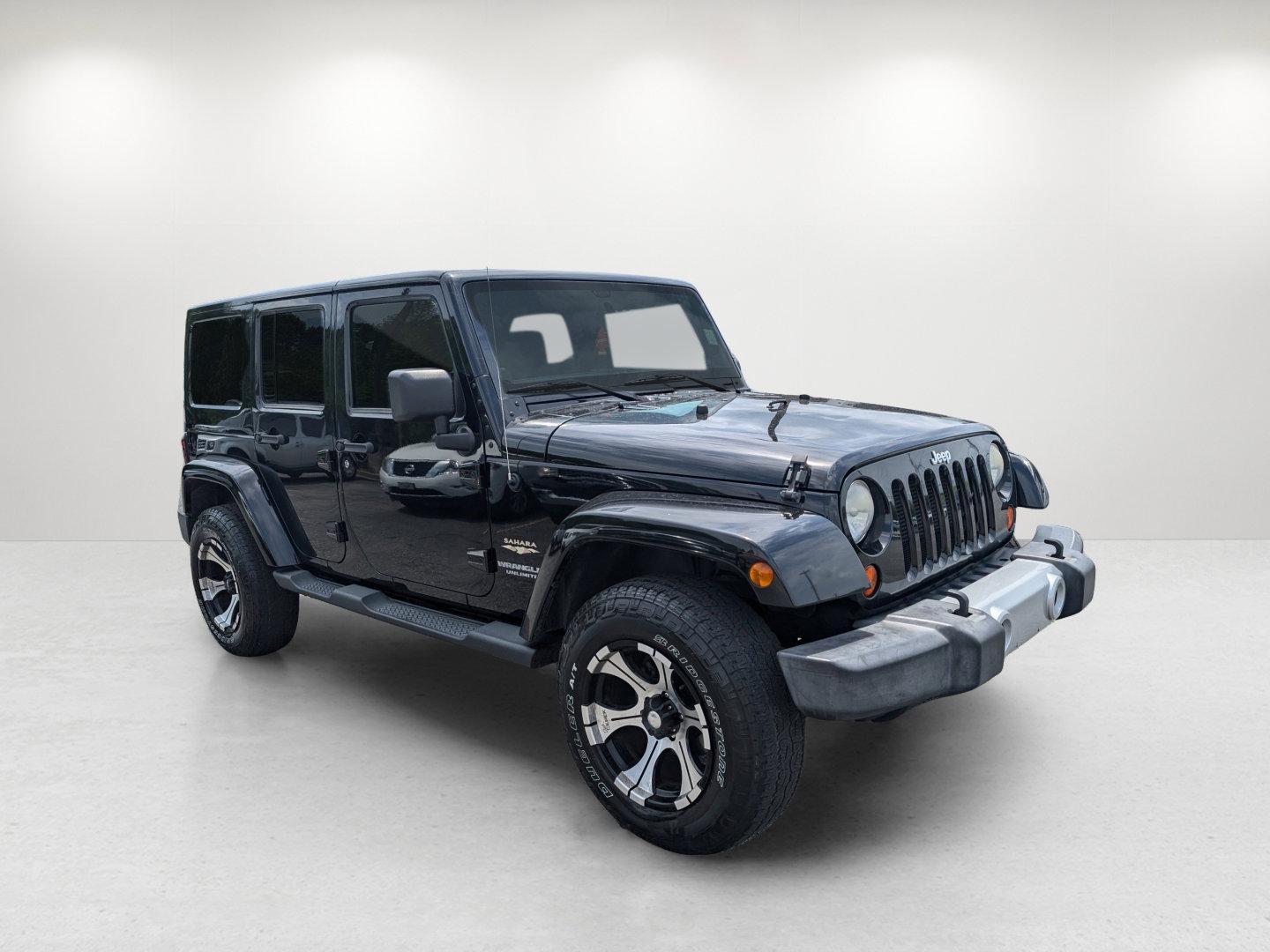2012 Black /Black Interior Jeep Wrangler Unlimited Sahara (1C4BJWEG4CL) with an Gas V6 3.6L/220 engine, 5-Speed Automatic transmission, located at 804 22nd Ave, Phenix City, AL, 36870, (334) 297-1860, 32.484749, -85.024475 - 2012 Jeep Wrangler Unlimited Sahara - Photo#2