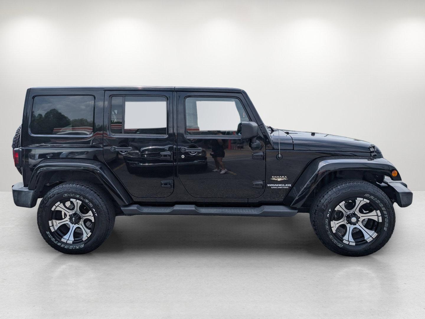 2012 Black /Black Interior Jeep Wrangler Unlimited Sahara (1C4BJWEG4CL) with an Gas V6 3.6L/220 engine, 5-Speed Automatic transmission, located at 804 22nd Ave, Phenix City, AL, 36870, (334) 297-1860, 32.484749, -85.024475 - 2012 Jeep Wrangler Unlimited Sahara - Photo#3