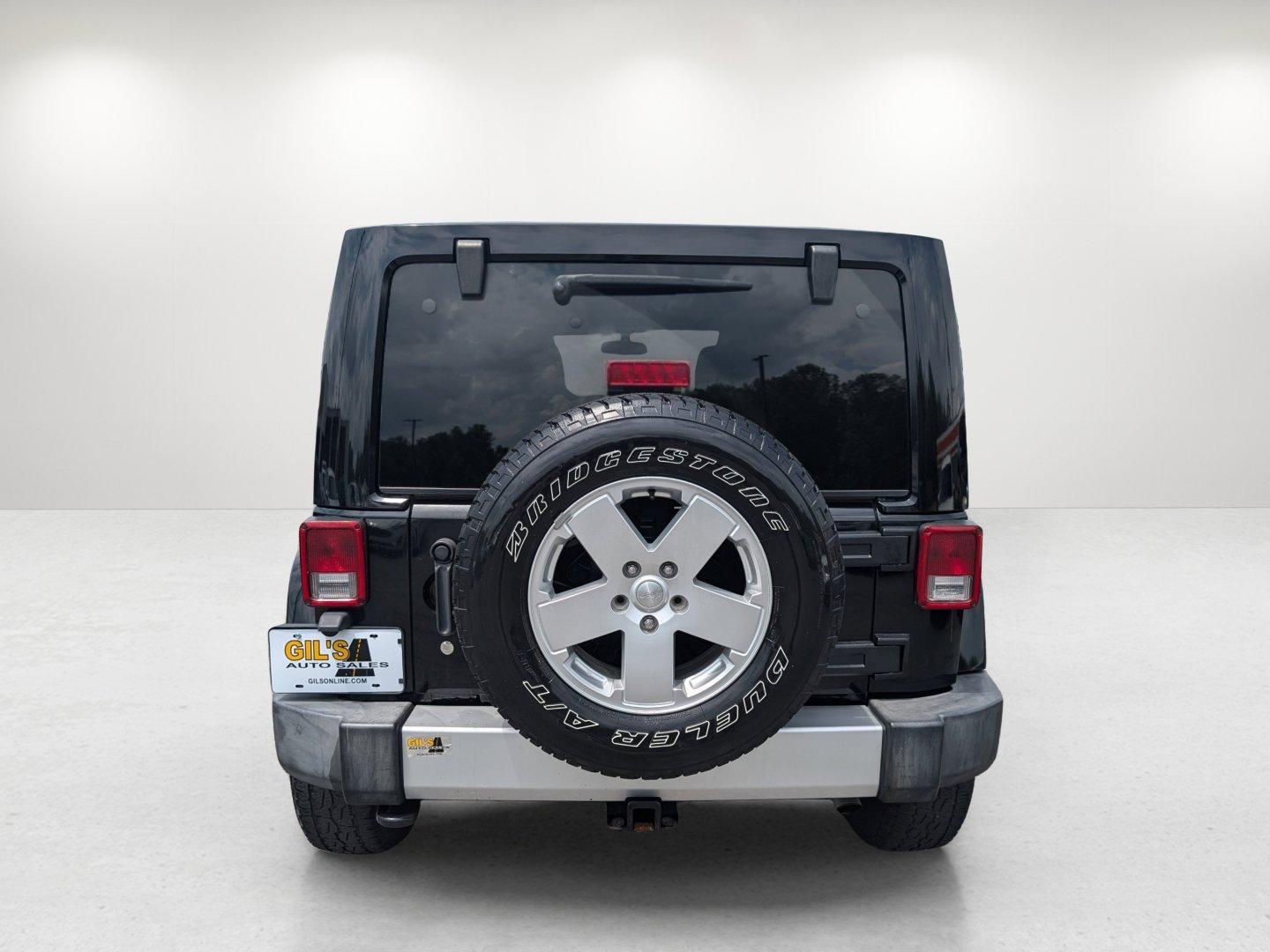 2012 Black /Black Interior Jeep Wrangler Unlimited Sahara (1C4BJWEG4CL) with an Gas V6 3.6L/220 engine, 5-Speed Automatic transmission, located at 804 22nd Ave, Phenix City, AL, 36870, (334) 297-1860, 32.484749, -85.024475 - 2012 Jeep Wrangler Unlimited Sahara - Photo#5