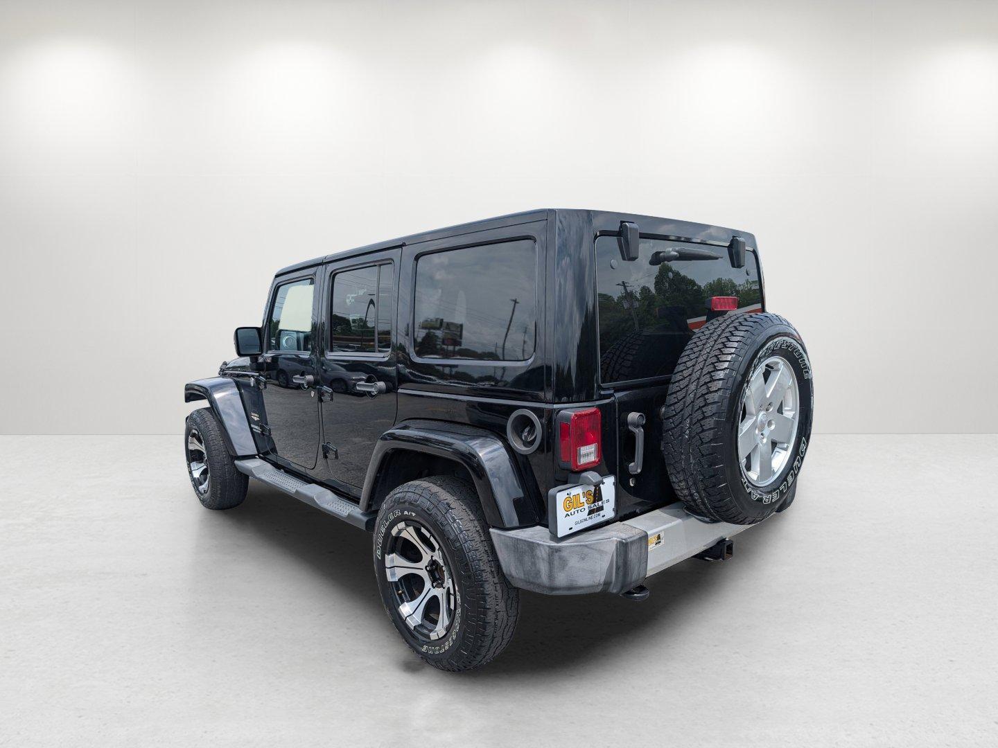 2012 Black /Black Interior Jeep Wrangler Unlimited Sahara (1C4BJWEG4CL) with an Gas V6 3.6L/220 engine, 5-Speed Automatic transmission, located at 804 22nd Ave, Phenix City, AL, 36870, (334) 297-1860, 32.484749, -85.024475 - 2012 Jeep Wrangler Unlimited Sahara - Photo#6