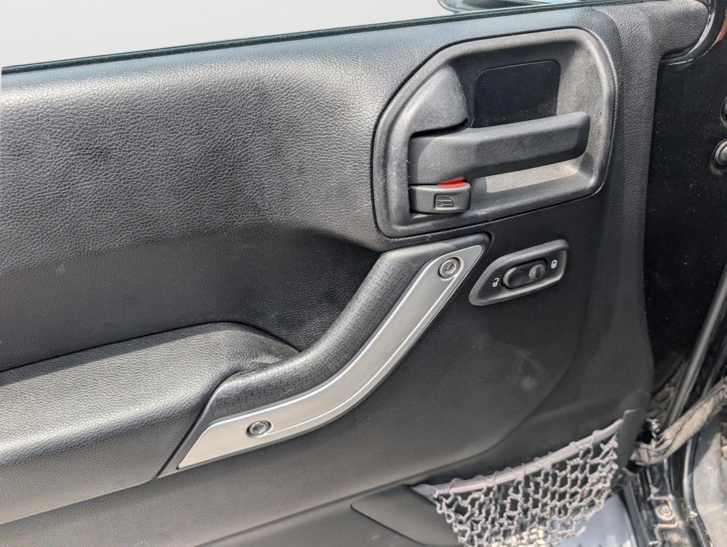 2012 Black /Black Interior Jeep Wrangler Unlimited Sahara (1C4BJWEG4CL) with an Gas V6 3.6L/220 engine, 5-Speed Automatic transmission, located at 804 22nd Ave, Phenix City, AL, 36870, (334) 297-1860, 32.484749, -85.024475 - 2012 Jeep Wrangler Unlimited Sahara - Photo#8