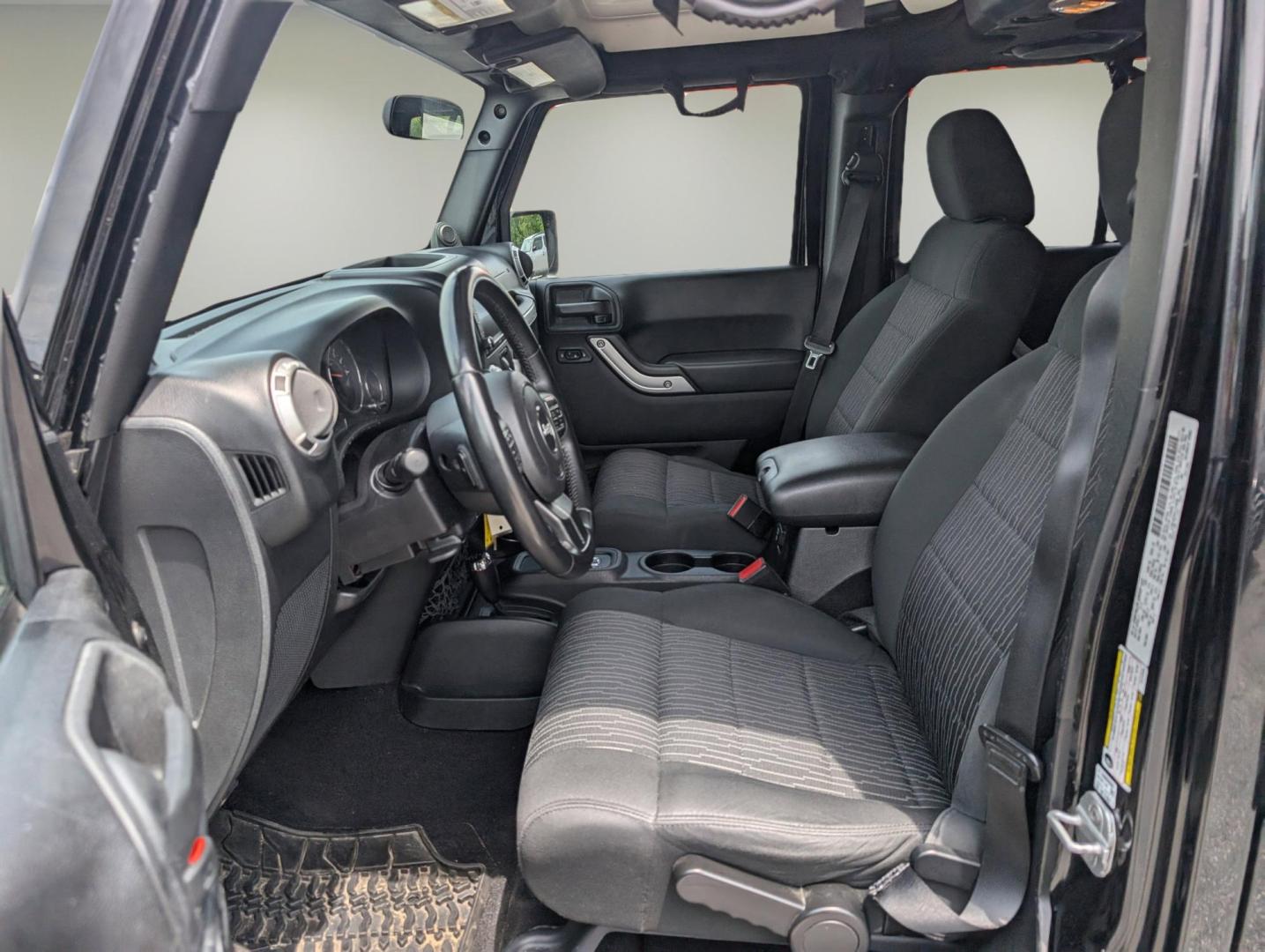 2012 Black /Black Interior Jeep Wrangler Unlimited Sahara (1C4BJWEG4CL) with an Gas V6 3.6L/220 engine, 5-Speed Automatic transmission, located at 804 22nd Ave, Phenix City, AL, 36870, (334) 297-1860, 32.484749, -85.024475 - 2012 Jeep Wrangler Unlimited Sahara - Photo#9