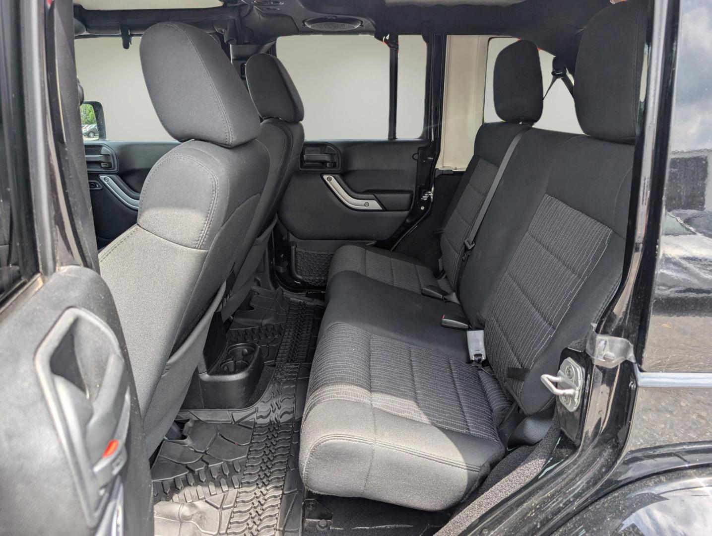 2012 Black /Black Interior Jeep Wrangler Unlimited Sahara (1C4BJWEG4CL) with an Gas V6 3.6L/220 engine, 5-Speed Automatic transmission, located at 804 22nd Ave, Phenix City, AL, 36870, (334) 297-1860, 32.484749, -85.024475 - 2012 Jeep Wrangler Unlimited Sahara - Photo#10