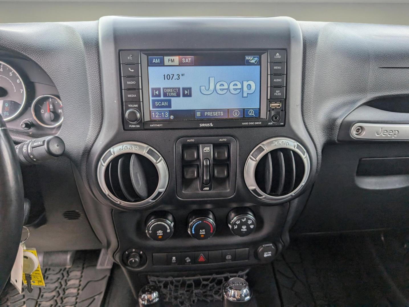 2012 Black /Black Interior Jeep Wrangler Unlimited Sahara (1C4BJWEG4CL) with an Gas V6 3.6L/220 engine, 5-Speed Automatic transmission, located at 804 22nd Ave, Phenix City, AL, 36870, (334) 297-1860, 32.484749, -85.024475 - 2012 Jeep Wrangler Unlimited Sahara - Photo#14