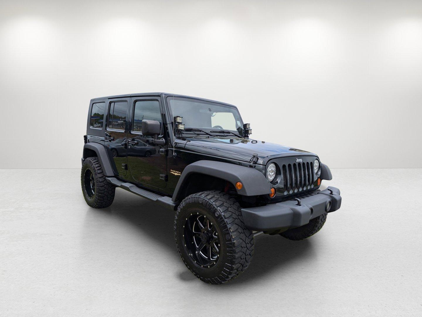 2012 /Black/Dark Saddle Interior Jeep Wrangler Unlimited Sahara (1C4BJWEG8CL) with an Gas V6 3.6L/220 engine, 5-Speed Automatic transmission, located at 3959 U.S. 80 W, Phenix City, AL, 36870, (334) 297-4885, 32.469296, -85.135185 - 2012 Jeep Wrangler Unlimited Sahara - Photo#4