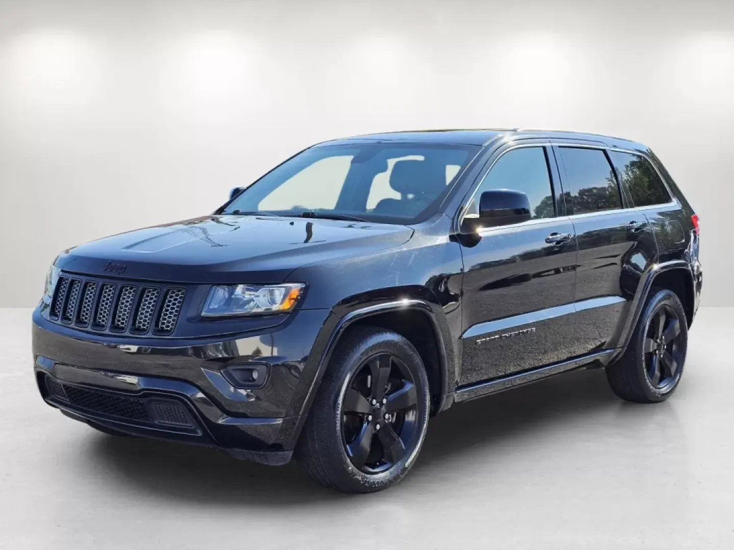 2014 /Black Jeep Grand Cherokee Altitude (1C4RJFAG4EC) with an Other engine, located at 3959 U.S. 80 W, Phenix City, AL, 36870, (334) 297-4885, 32.469296, -85.135185 - Looking for a reliable SUV to elevate your family adventures or daily commutes? Look no further! At Gils Auto in Phenix City, AL, we proudly present this stunning 2014 Jeep Grand Cherokee Altitude, perfect for those who seek a blend of performance and comfort. Whether you're navigating through city - Photo#1