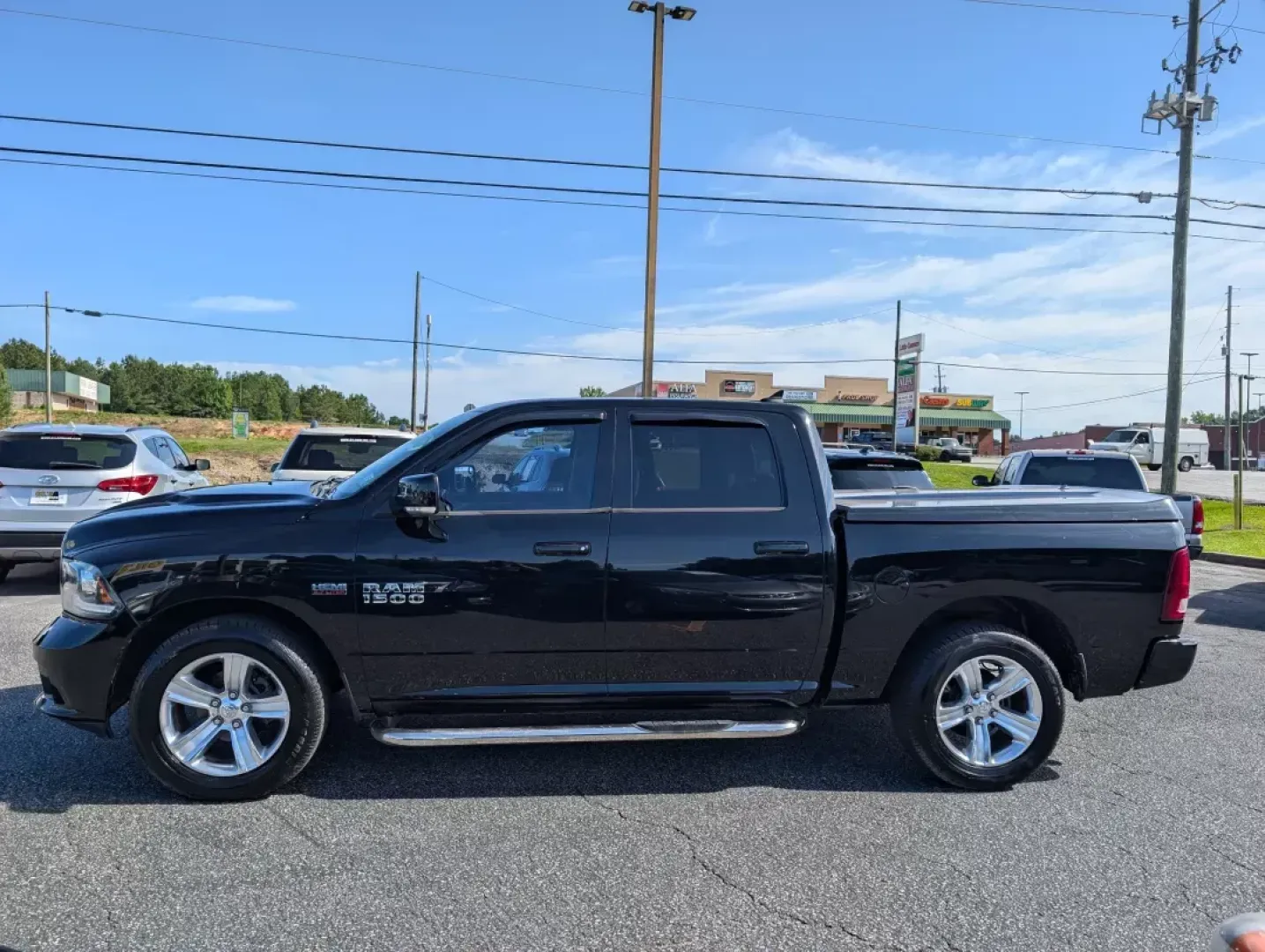 2014 /Black Ram 1500 Sport (1C6RR6MTXES) with an Regular Unleaded V-8 5.7 L/345 engine, 8-Speed Automatic w/OD transmission, located at 3959 U.S. 80 W, Phenix City, AL, 36870, (334) 297-4885, 32.469296, -85.135185 - 2014 Ram 1500 Sport - Photo#7