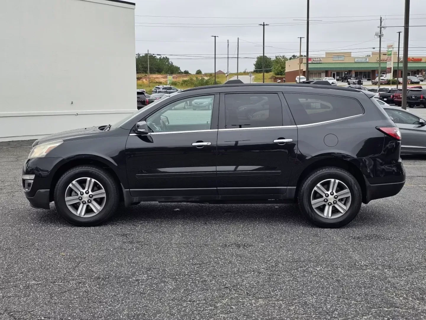 2015 /Ebony Chevrolet Traverse LT (1GNKRHKDXFJ) with an Other engine, located at 5115 14th Ave., Columbus, GA, 31904, (706) 323-0345, 32.511494, -84.971046 - **Elevate Your Family Adventures with the 2015 Chevrolet Traverse LT at Gils Auto!**<br /> <br /> Are you searching for the perfect family SUV that combines space, comfort, and the latest technology? Look no further than this 2015 Chevrolet Traverse LT, now available at Gils Auto in Phenix City, AL. - Photo#7