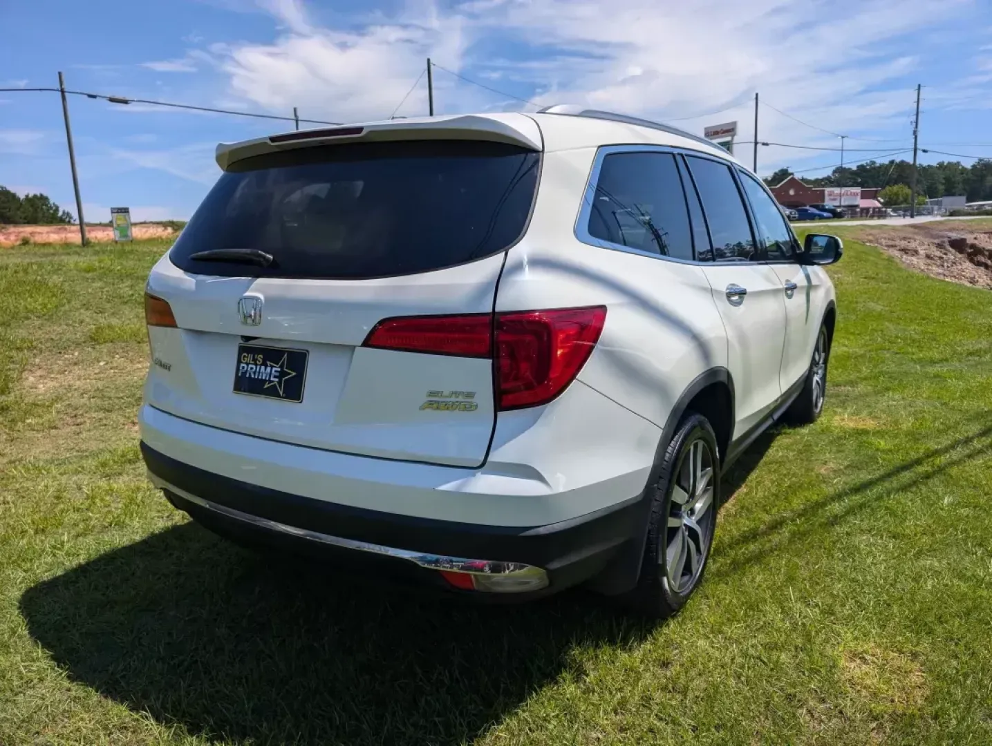 2016 Honda Pilot Elite (5FNYF6H07GB) with an Other engine, located at 3959 U.S. 80 W, Phenix City, AL, 36870, (334) 297-4885, 32.469296, -85.135185 - **Adventure Awaits with the 2016 Honda Pilot Elite - Perfect for Family Road Trips!**<br /> <br /> If you're searching for a reliable vehicle that combines comfort, style, and capability, look no further than the 2016 Honda Pilot Elite. This versatile SUV is designed for growing families and weekend - Photo#4