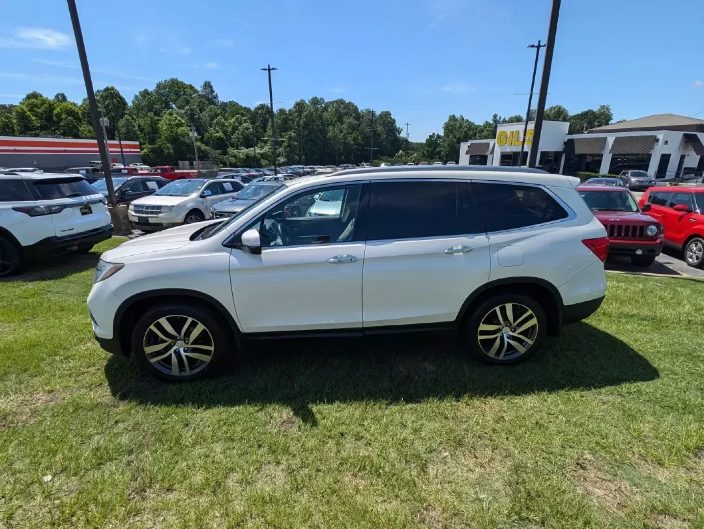 2016 Honda Pilot Elite (5FNYF6H07GB) with an Other engine, located at 3959 U.S. 80 W, Phenix City, AL, 36870, (334) 297-4885, 32.469296, -85.135185 - **Adventure Awaits with the 2016 Honda Pilot Elite - Perfect for Family Road Trips!**<br /> <br /> If you're searching for a reliable vehicle that combines comfort, style, and capability, look no further than the 2016 Honda Pilot Elite. This versatile SUV is designed for growing families and weekend - Photo#7