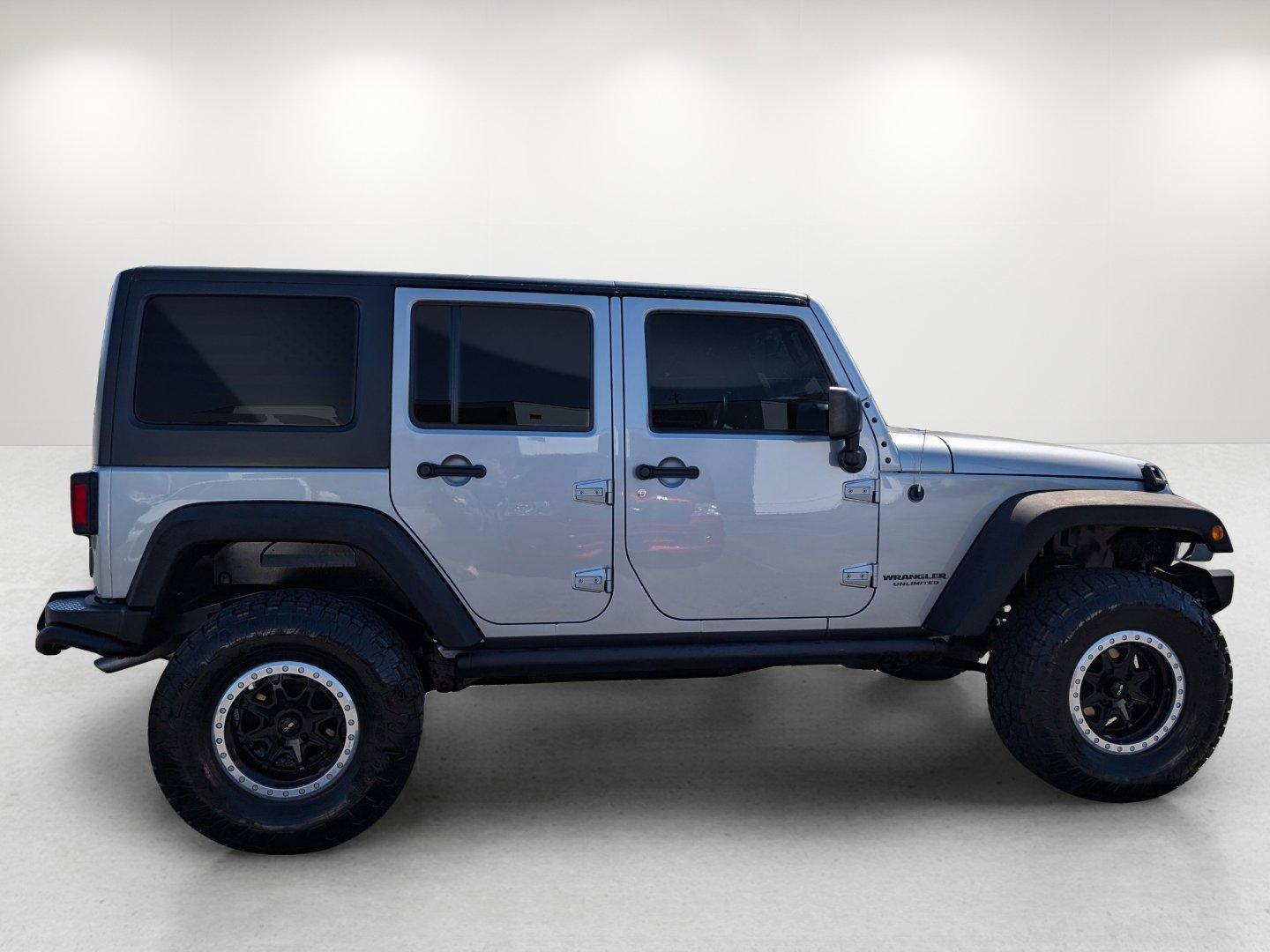 2017 /Black Jeep Wrangler Unlimited Willys Wheeler (1C4BJWDG1HL) with an Regular Unleaded V-6 3.6 L/220 engine, 5-Speed Automatic w/OD transmission, located at 1430 Gateway Drive, Opelika, AL, 36801, (334) 239-0944, 32.637871, -85.409790 - 2017 Jeep Wrangler Unlimited Willys Wheeler - Photo#3
