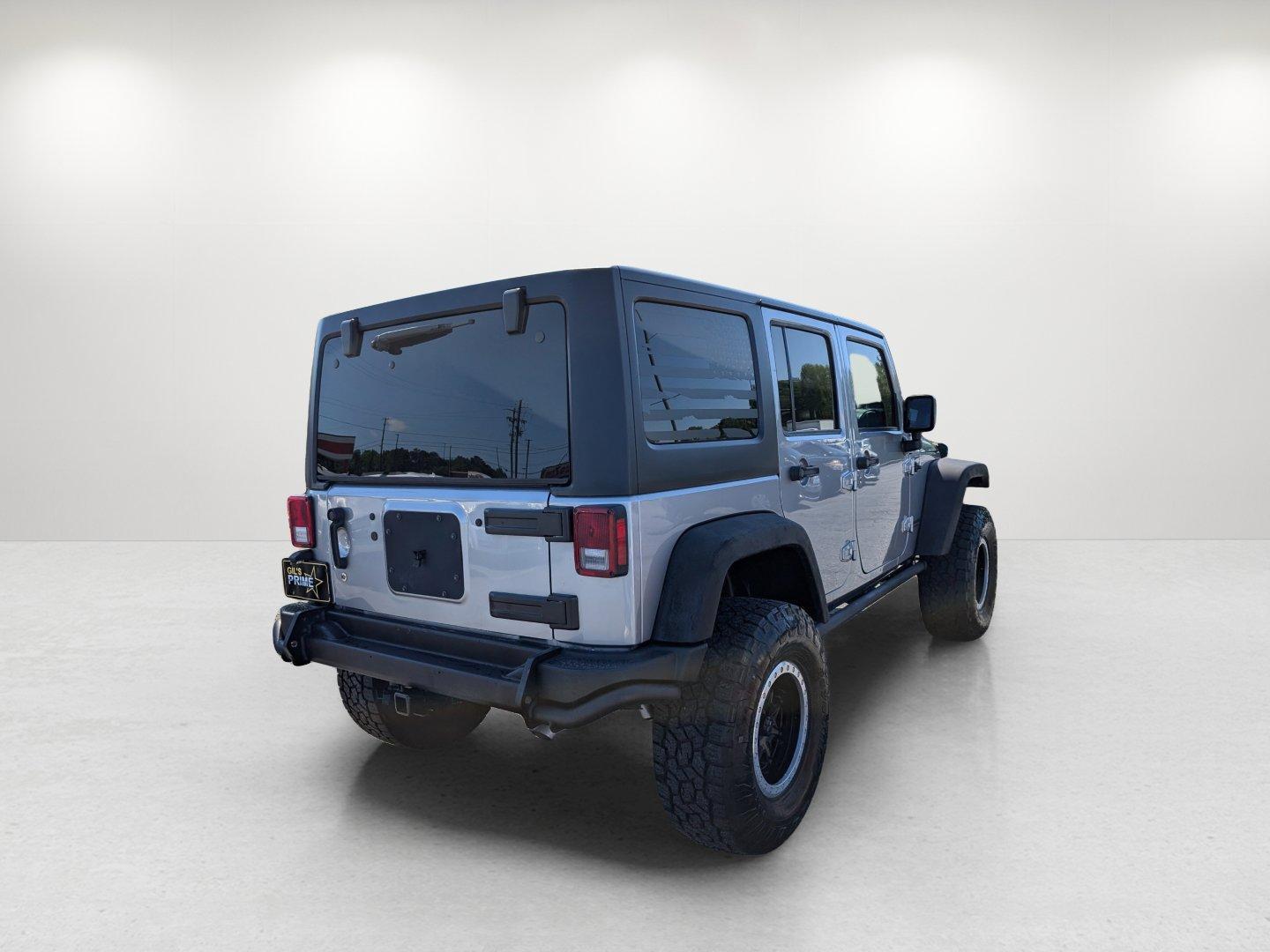 2017 /Black Jeep Wrangler Unlimited Willys Wheeler (1C4BJWDG1HL) with an Regular Unleaded V-6 3.6 L/220 engine, 5-Speed Automatic w/OD transmission, located at 1430 Gateway Drive, Opelika, AL, 36801, (334) 239-0944, 32.637871, -85.409790 - 2017 Jeep Wrangler Unlimited Willys Wheeler - Photo#4