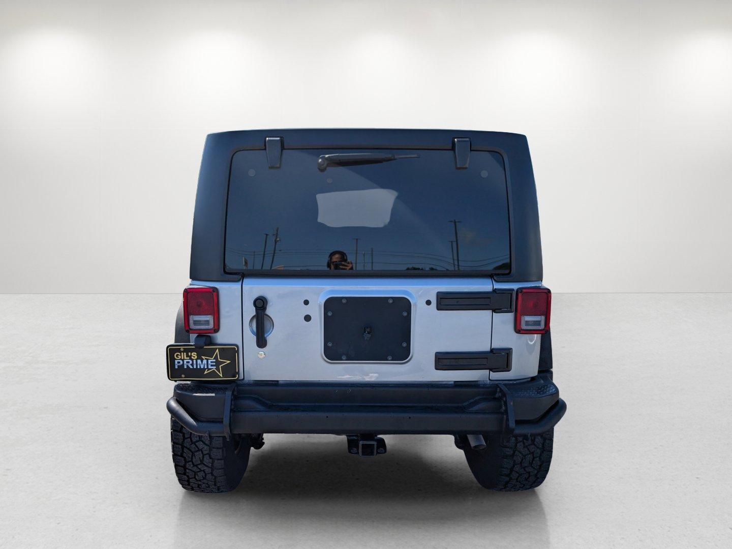 2017 /Black Jeep Wrangler Unlimited Willys Wheeler (1C4BJWDG1HL) with an Regular Unleaded V-6 3.6 L/220 engine, 5-Speed Automatic w/OD transmission, located at 1430 Gateway Drive, Opelika, AL, 36801, (334) 239-0944, 32.637871, -85.409790 - 2017 Jeep Wrangler Unlimited Willys Wheeler - Photo#5