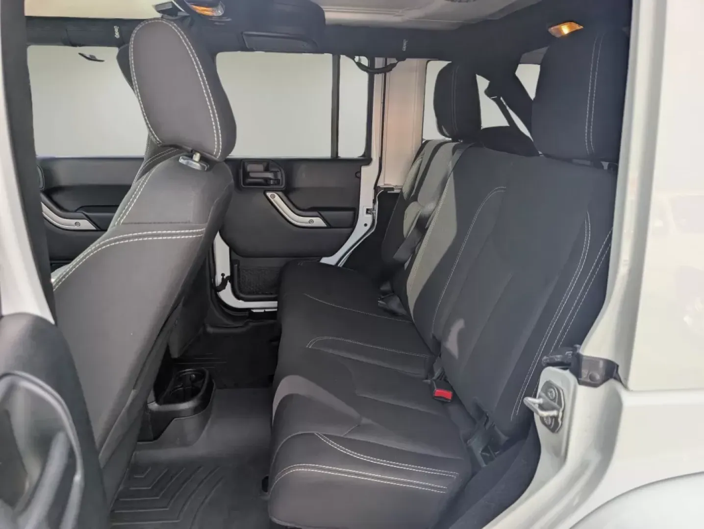 2018 /Black Jeep Wrangler Sahara (1C4BJWEG4JL) with an Other engine, located at 7000 Northlake Connector, Columbus, GA, 31904, (706) 987-8085, 32.524975, -84.978134 - **Adventure Awaits: 2018 Jeep Wrangler Sahara at Gils Auto**<br /> <br /> Are you ready to embark on your next adventure? Whether you're planning a weekend getaway to the stunning landscapes of Lake Martin or navigating through the vibrant streets of Phenix City, this 2018 Jeep Wrangler Sahara is yo - Photo#10