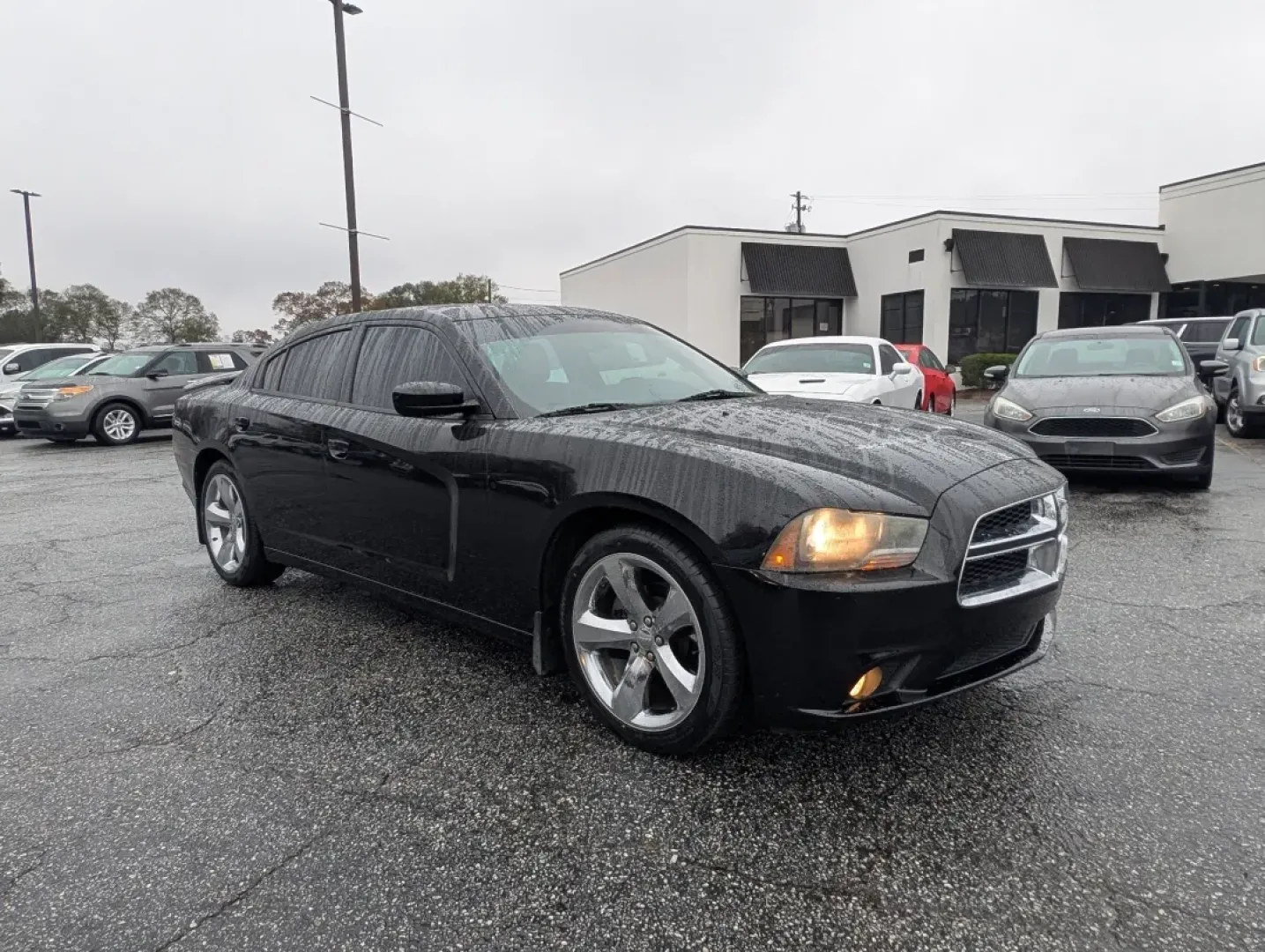 2013 /Black/Red Interior Dodge Charger SXT Plus (2C3CDXHG9DH) with an Other engine, located at 804 22nd Ave, Phenix City, AL, 36870, (334) 297-1860, 32.484749, -85.024475 - Elevate your driving experience with the 2013 Dodge Charger SXT Plus, the perfect vehicle for those who crave style, performance, and comfort. Whether you're navigating the bustling streets of downtown Phenix City or planning a weekend getaway to Lake Eufaula, this sporty coupe combines power and so - Photo#2