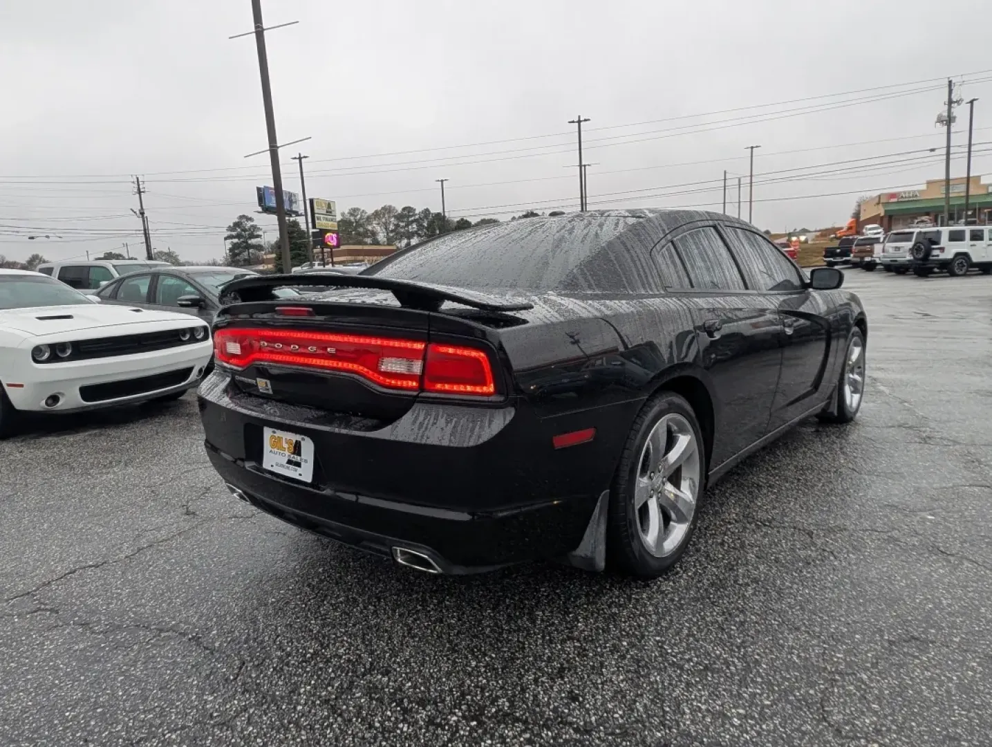 2013 /Black/Red Interior Dodge Charger SXT Plus (2C3CDXHG9DH) with an Other engine, located at 804 22nd Ave, Phenix City, AL, 36870, (334) 297-1860, 32.484749, -85.024475 - Elevate your driving experience with the 2013 Dodge Charger SXT Plus, the perfect vehicle for those who crave style, performance, and comfort. Whether you're navigating the bustling streets of downtown Phenix City or planning a weekend getaway to Lake Eufaula, this sporty coupe combines power and so - Photo#4