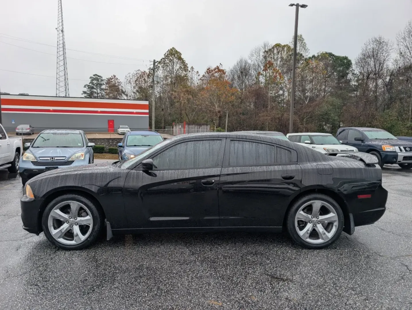 2013 /Black/Red Interior Dodge Charger SXT Plus (2C3CDXHG9DH) with an Other engine, located at 804 22nd Ave, Phenix City, AL, 36870, (334) 297-1860, 32.484749, -85.024475 - Elevate your driving experience with the 2013 Dodge Charger SXT Plus, the perfect vehicle for those who crave style, performance, and comfort. Whether you're navigating the bustling streets of downtown Phenix City or planning a weekend getaway to Lake Eufaula, this sporty coupe combines power and so - Photo#7