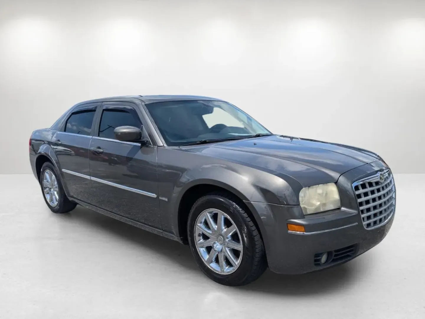 2009 /Dark slate gray Chrysler 300 Touring (2C3KA53V69H) with an Other engine, located at 1430 Gateway Drive, Opelika, AL, 36801, (334) 239-0944, 32.637871, -85.409790 - Welcome to a new chapter in your driving experience! Whether you're navigating the bustling streets of Phenix City or embarking on a weekend getaway, the 2009 Chrysler 300 Touring is the perfect vehicle for those seeking a blend of comfort, style, and reliability. With its deep Dark Titanium Metalli - Photo#2