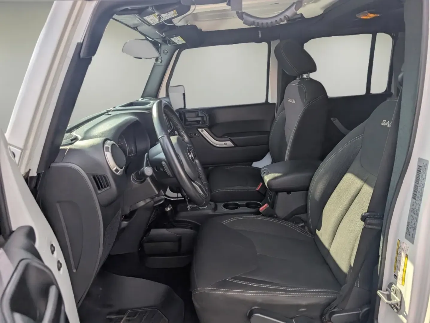 2018 /Black Jeep Wrangler Sahara (1C4BJWEG4JL) with an Other engine, located at 7000 Northlake Connector, Columbus, GA, 31904, (706) 987-8085, 32.524975, -84.978134 - **Adventure Awaits: 2018 Jeep Wrangler Sahara at Gils Auto**<br /> <br /> Are you ready to embark on your next adventure? Whether you're planning a weekend getaway to the stunning landscapes of Lake Martin or navigating through the vibrant streets of Phenix City, this 2018 Jeep Wrangler Sahara is yo - Photo#9