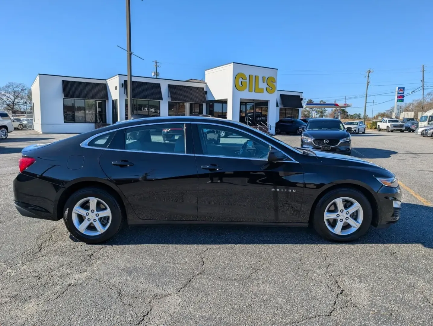 2022 /Dark Atmosphere/ Medium Ash Gray Chevrolet Malibu LS (1G1ZC5ST7NF) with an Other engine, located at 3959 U.S. 80 W, Phenix City, AL, 36870, (334) 297-4885, 32.469296, -85.135185 - **Discover the Perfect Balance of Style and Comfort with the 2022 Chevrolet Malibu at Gils Auto - Phenix City**<br /> <br /> Are you looking for a reliable sedan that effortlessly combines modern technology, spacious comfort, and fuel efficiency? Whether you're commuting to work, shuttling the kids - Photo#3