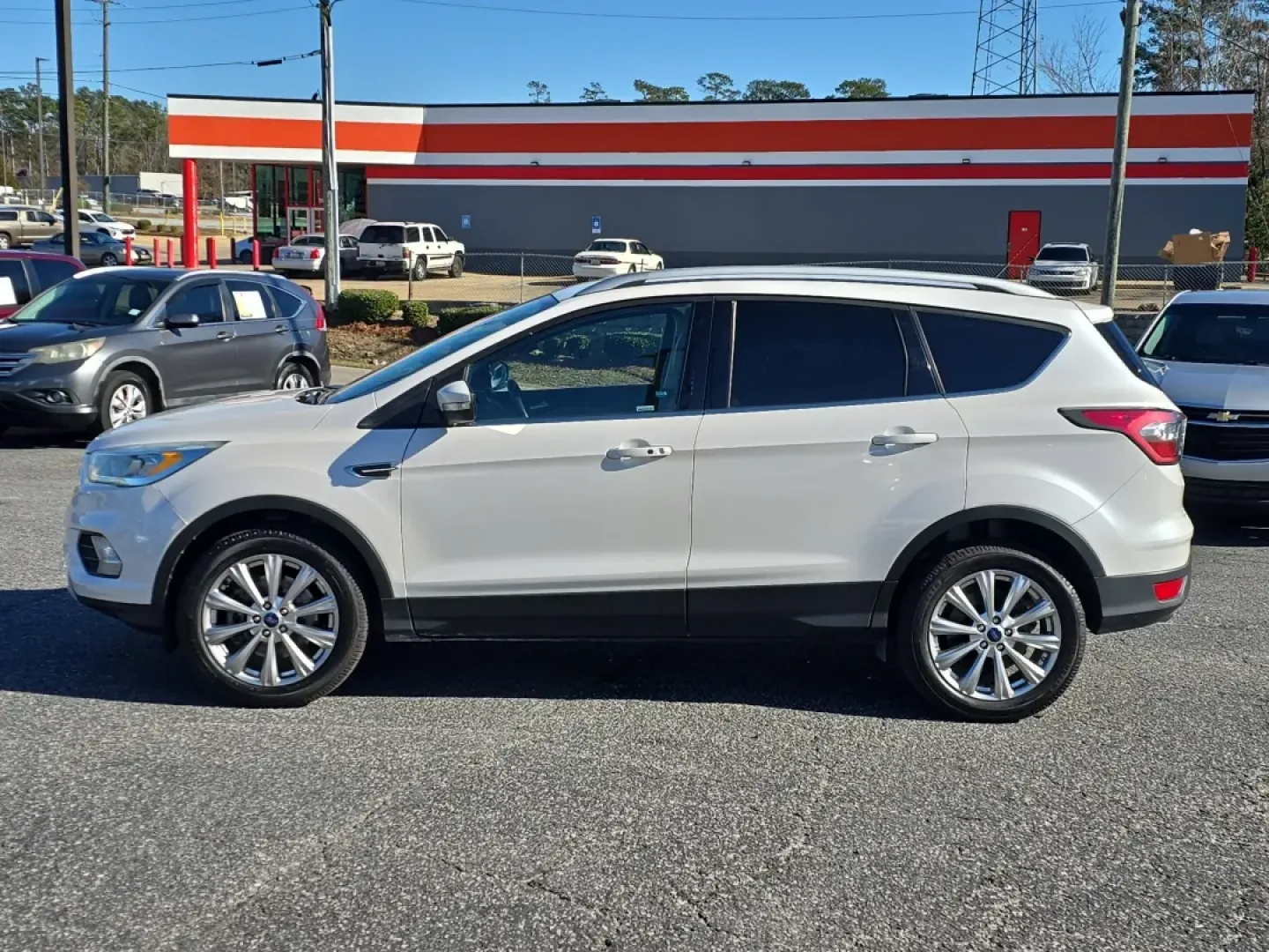 2017 /Medium Light Stone Ford Escape Titanium (1FMCU9J9XHU) with an Other engine, located at 3959 U.S. 80 W, Phenix City, AL, 36870, (334) 297-4885, 32.469296, -85.135185 - **Discover Adventure and Comfort with the 2017 Ford Escape Titanium at Gils Auto - Phenix City!**<br /> <br /> Are you ready to elevate your daily commute, family road trips, or weekend adventures? The 2017 Ford Escape Titanium is your ticket to a lifestyle full of exploration and comfort. Perfectly - Photo#8
