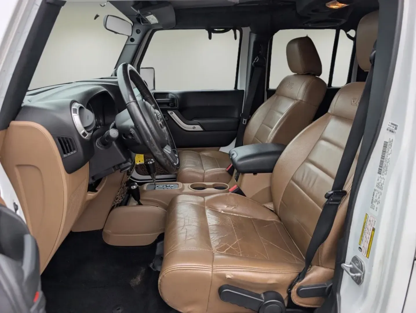 2012 /Black/Dark Saddle Interior Jeep Wrangler Sahara (1C4BJWEG5CL) with an Other engine, located at 3959 U.S. 80 W, Phenix City, AL, 36870, (334) 297-4885, 32.469296, -85.135185 - **Unleash Your Adventurous Spirit with the 2012 Jeep Wrangler Sahara!**<br /> <br /> Are you ready for your next big adventure? Whether you're navigating rugged trails, cruising through the scenic roads of Phenix City, or simply enjoying the freedom that comes with driving a convertible SUV, the 201 - Photo#9