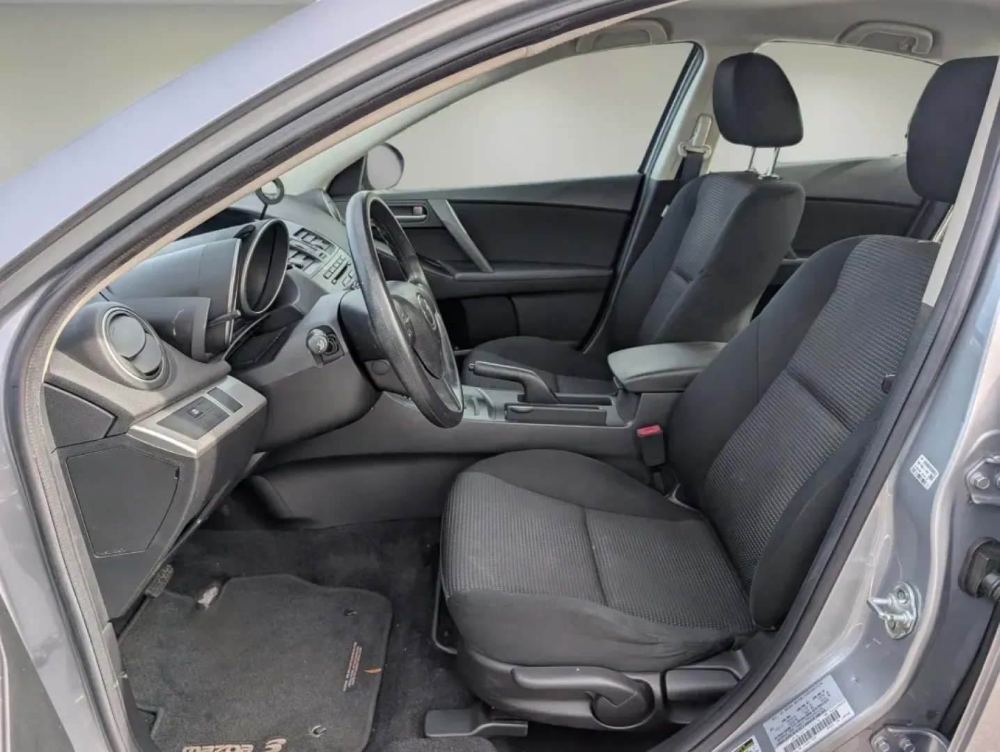 2012 /Black Mazda Mazda3 i Sport (JM1BL1UF7C1) with an Other engine, located at 1430 Gateway Drive, Opelika, AL, 36801, (334) 239-0944, 32.637871, -85.409790 - Are you searching for a reliable and stylish sedan that perfectly balances functionality and comfort? Look no further! At Gils Auto in Phenix City, AL, we have just the vehicle for you: a sleek 2012 Mazda3 i Sport. This sedan is not only great for daily commutes and weekend getaways, but it's also a - Photo#9