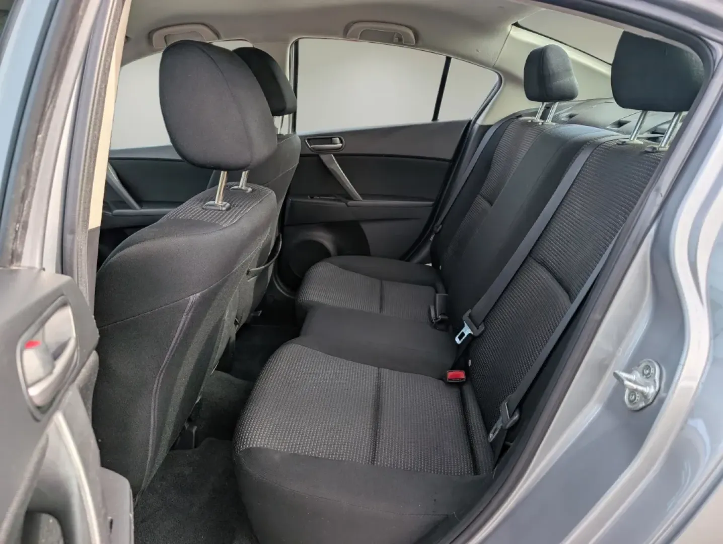 2012 /Black Mazda Mazda3 i Sport (JM1BL1UF7C1) with an Other engine, located at 1430 Gateway Drive, Opelika, AL, 36801, (334) 239-0944, 32.637871, -85.409790 - Are you searching for a reliable and stylish sedan that perfectly balances functionality and comfort? Look no further! At Gils Auto in Phenix City, AL, we have just the vehicle for you: a sleek 2012 Mazda3 i Sport. This sedan is not only great for daily commutes and weekend getaways, but it's also a - Photo#10