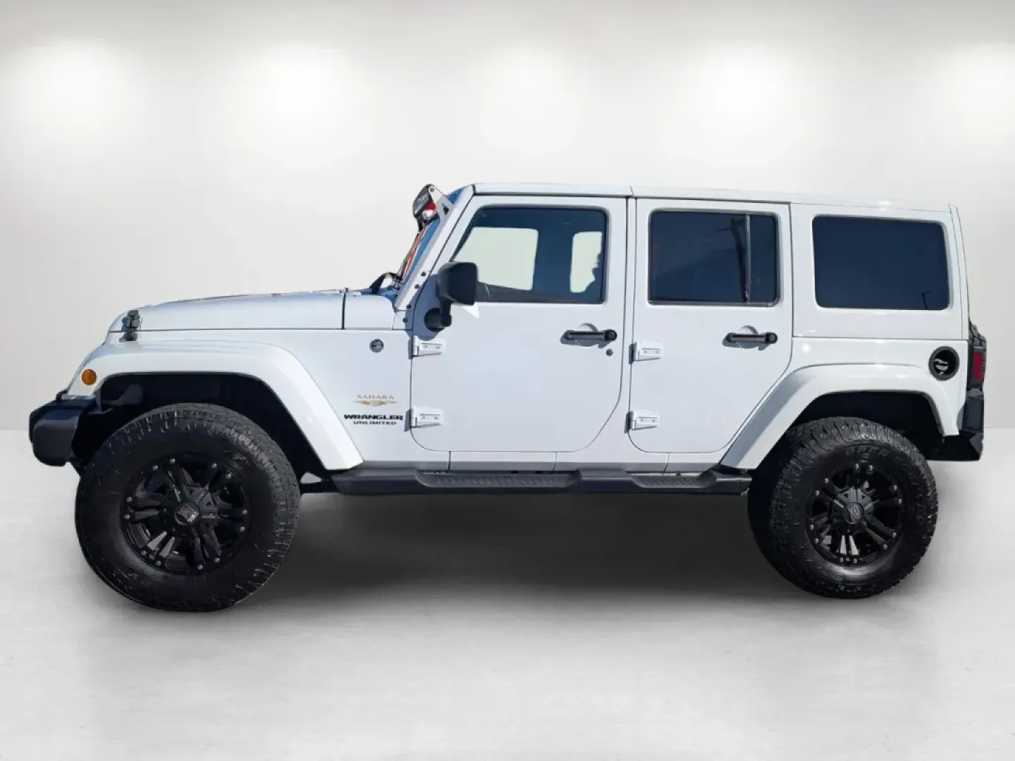 2015 /Dark Saddle/Black Jeep Wrangler Sahara (1C4BJWEGXFL) with an Other engine, located at 1430 Gateway Drive, Opelika, AL, 36801, (334) 239-0944, 32.637871, -85.409790 - **Unleash Adventure with the 2015 Jeep Wrangler Sahara - Your Ultimate Companion for Every Journey!**<br /> <br /> Looking for a vehicle that embodies freedom and adventure? Meet the 2015 Jeep Wrangler Sahara, a rugged SUV that's perfect for outdoor enthusiasts and urban explorers alike. Whether you - Photo#7