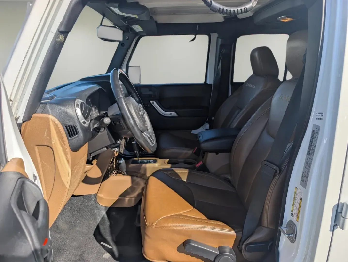 2015 /Dark Saddle/Black Jeep Wrangler Sahara (1C4BJWEGXFL) with an Other engine, located at 1430 Gateway Drive, Opelika, AL, 36801, (334) 239-0944, 32.637871, -85.409790 - **Unleash Adventure with the 2015 Jeep Wrangler Sahara - Your Ultimate Companion for Every Journey!**<br /> <br /> Looking for a vehicle that embodies freedom and adventure? Meet the 2015 Jeep Wrangler Sahara, a rugged SUV that's perfect for outdoor enthusiasts and urban explorers alike. Whether you - Photo#9