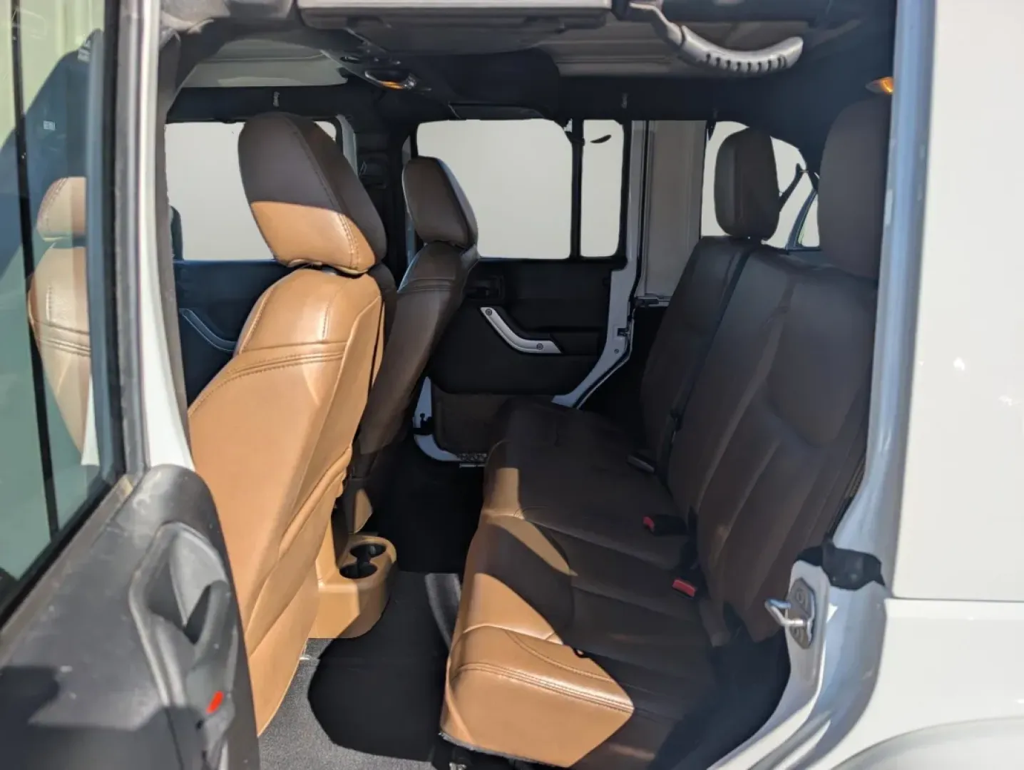 2015 /Dark Saddle/Black Jeep Wrangler Sahara (1C4BJWEGXFL) with an Other engine, located at 1430 Gateway Drive, Opelika, AL, 36801, (334) 239-0944, 32.637871, -85.409790 - **Unleash Adventure with the 2015 Jeep Wrangler Sahara - Your Ultimate Companion for Every Journey!**<br /> <br /> Looking for a vehicle that embodies freedom and adventure? Meet the 2015 Jeep Wrangler Sahara, a rugged SUV that's perfect for outdoor enthusiasts and urban explorers alike. Whether you - Photo#10