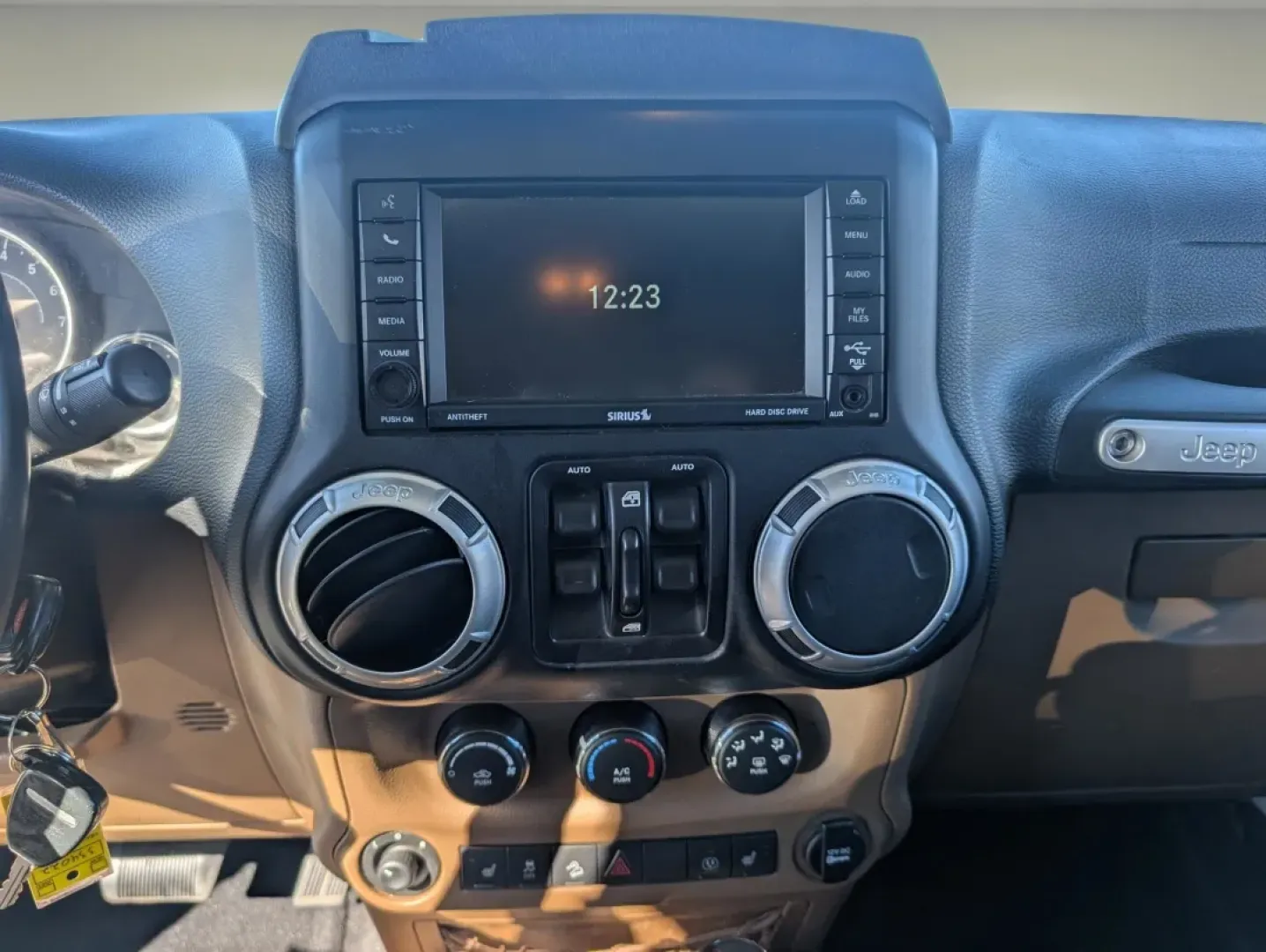 2015 /Dark Saddle/Black Jeep Wrangler Sahara (1C4BJWEGXFL) with an Other engine, located at 1430 Gateway Drive, Opelika, AL, 36801, (334) 239-0944, 32.637871, -85.409790 - **Unleash Adventure with the 2015 Jeep Wrangler Sahara - Your Ultimate Companion for Every Journey!**<br /> <br /> Looking for a vehicle that embodies freedom and adventure? Meet the 2015 Jeep Wrangler Sahara, a rugged SUV that's perfect for outdoor enthusiasts and urban explorers alike. Whether you - Photo#14