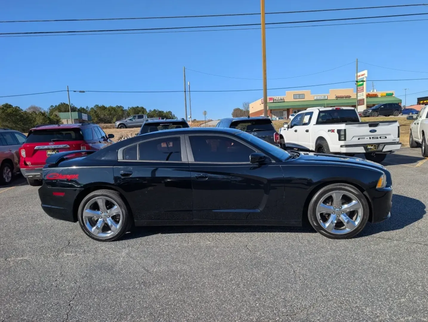 2012 /Black Interior Dodge Charger SXT (2C3CDXHG2CH) with an Other engine, located at 3959 U.S. 80 W, Phenix City, AL, 36870, (334) 297-4885, 32.469296, -85.135185 - **Experience the Thrill of the Open Road with the 2012 Dodge Charger SXT at Gils Auto - Prattville!**<br /> <br /> Are you on the lookout for a stylish, powerful vehicle that can keep up with your active lifestyle? The 2012 Dodge Charger SXT is perfect for those who appreciate a blend of performance - Photo#3