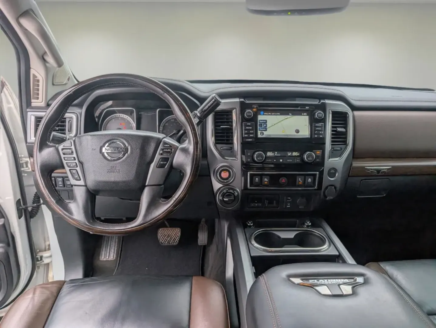 2018 /Black/Brown Nissan Titan Platinum Reserve (1N6AA1E59JN) with an Other engine, located at 804 22nd Ave, Phenix City, AL, 36870, (334) 297-1860, 32.484749, -85.024475 - Are you ready to elevate your driving experience and embrace a lifestyle filled with adventure? The 2018 Nissan Titan Platinum Reserve is here to make your journeys unforgettable! Whether you're navigating the bustling streets of Phenix City or heading off-road for a weekend getaway, this Crew Cab P - Photo#11