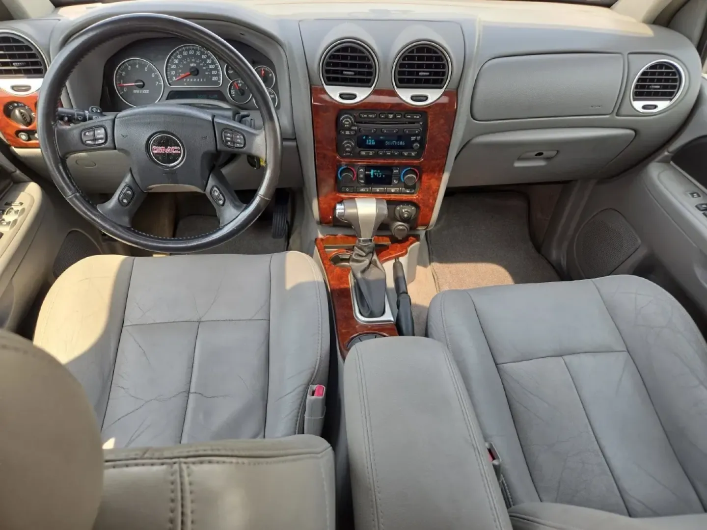 2006 /Light Gray GMC Envoy SLT (1GKDS13S662) with an Other engine, located at 804 22nd Ave, Phenix City, AL, 36870, (334) 297-1860, 32.484749, -85.024475 - **Explore New Adventures with the 2006 GMC Envoy SLT at Gils Auto in Prattville, AL!**<br /> <br /> Are you ready to elevate your driving experience? Whether you're planning a weekend getaway, commuting to work, or simply need a reliable vehicle for the family, the 2006 GMC Envoy SLT is your perfect - Photo#14